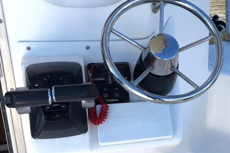  Yacht Photos Pics Steering wheel and controls of 2017 Osprey 30 Fisherman boat.