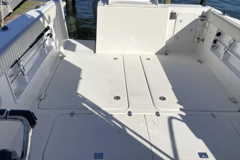  Yacht Photos Pics 2017 Osprey 30 Fisherman boat deck with storage compartments and seating.