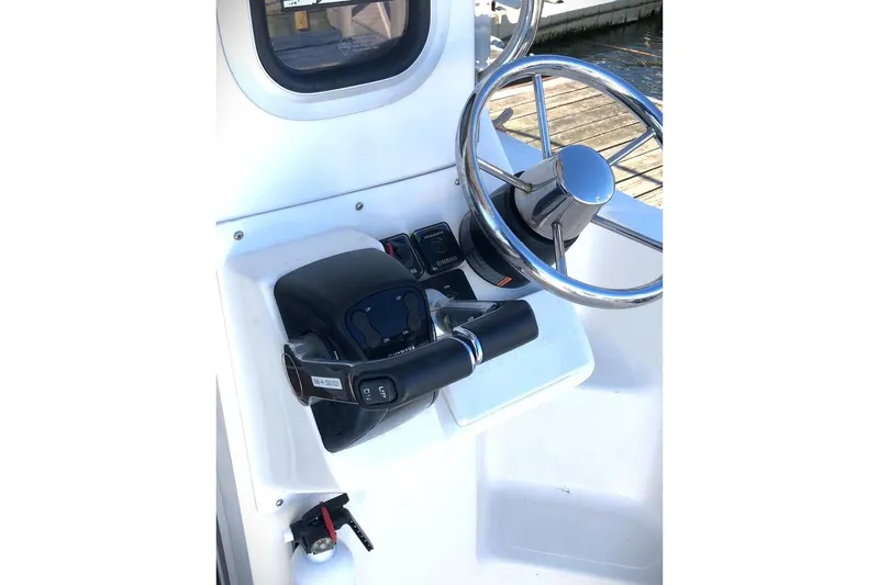  Yacht Photos Pics 2017 Osprey 30 Fisherman boat helm with steering wheel and controls.