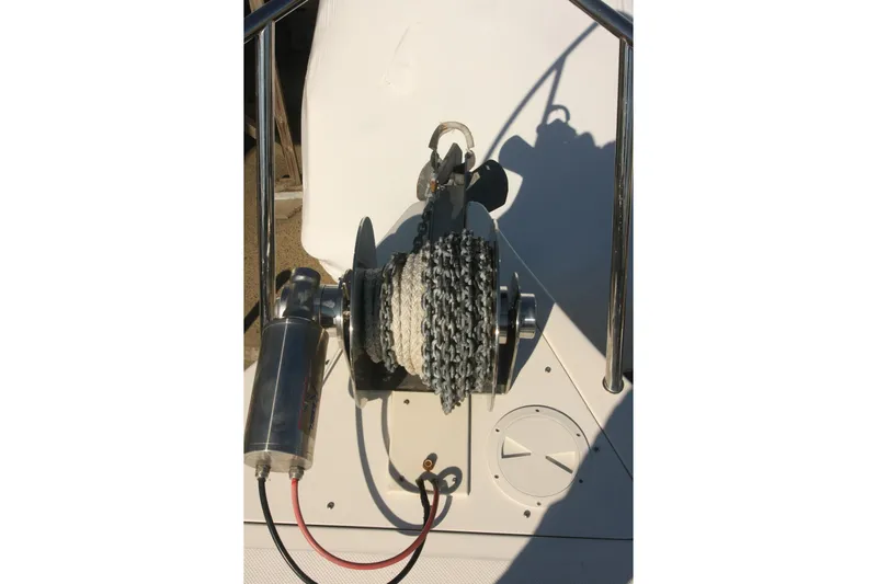 Yacht Photos Pics Anchor winch on 2017 Osprey 30 Fisherman boat deck, featuring chain and rope.
