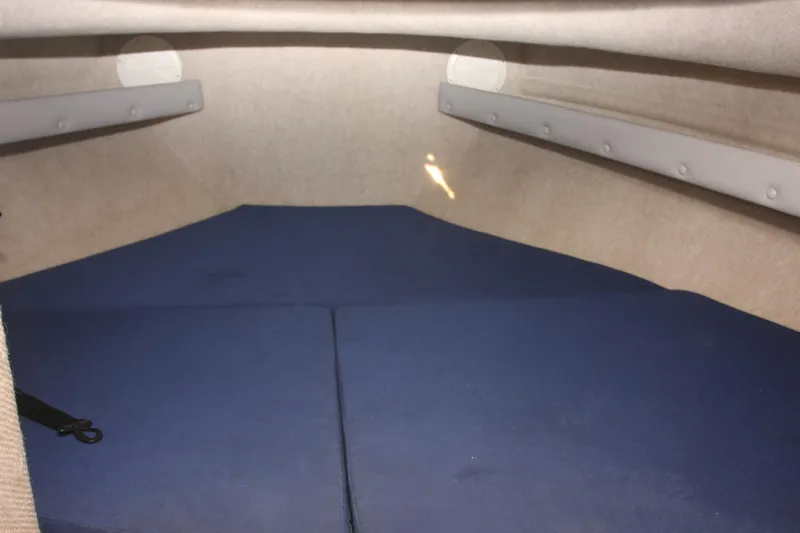  Yacht Photos Pics Interior cabin of 2017 Osprey 30 Fisherman boat with blue cushions.