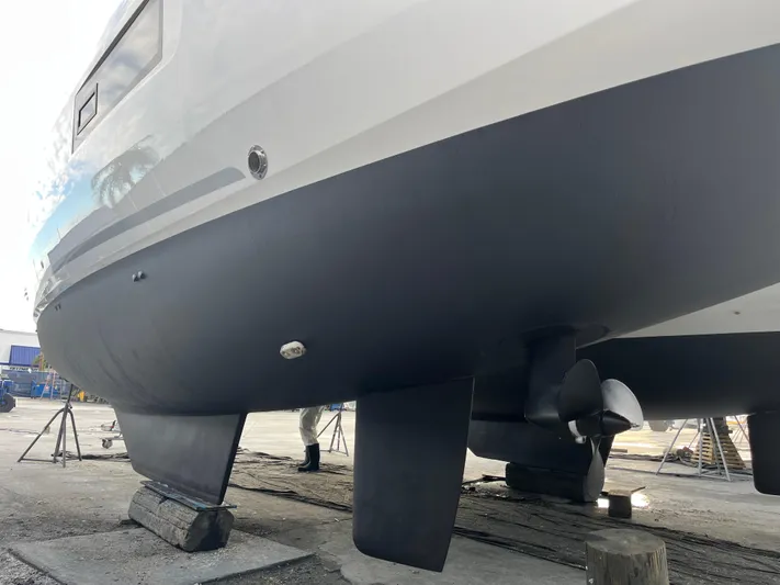  Yacht Photos Pics 2023 Lagoon 40 catamaran hull and propeller in dry dock.