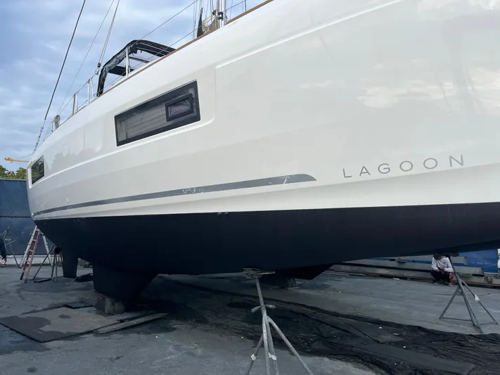  Yacht Photos Pics 2023 Lagoon 40 catamaran on dry dock, showcasing sleek design and modern features.