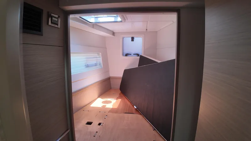  Yacht Photos Pics Interior of 2023 Lagoon 40 catamaran cabin, featuring modern design and ample natural light.