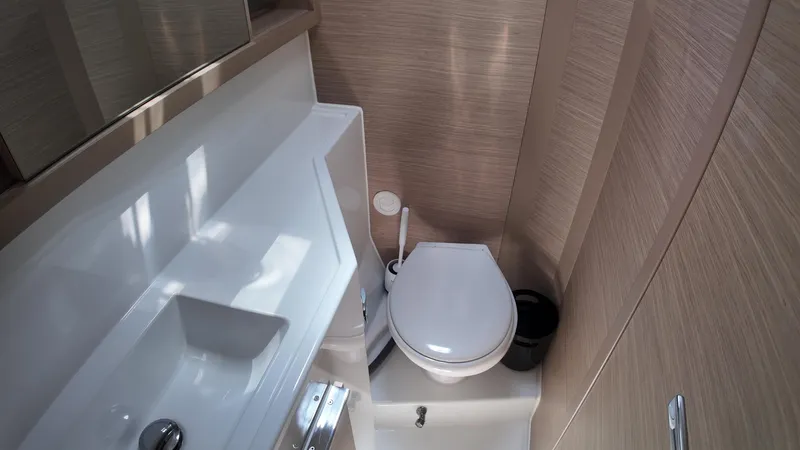  Yacht Photos Pics 2023 Lagoon 40 yacht bathroom with modern sink and toilet.