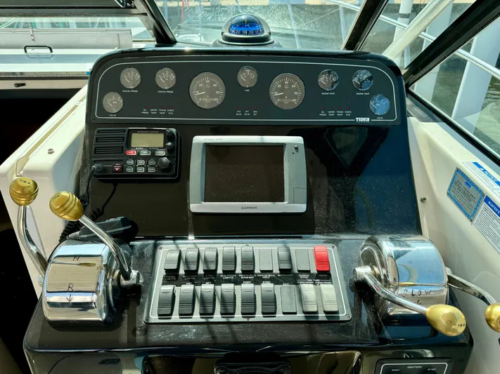 Castaways Yacht Photos Pics 2006 Tiara Yachts 29 Open dashboard with gauges, controls, and Garmin display.