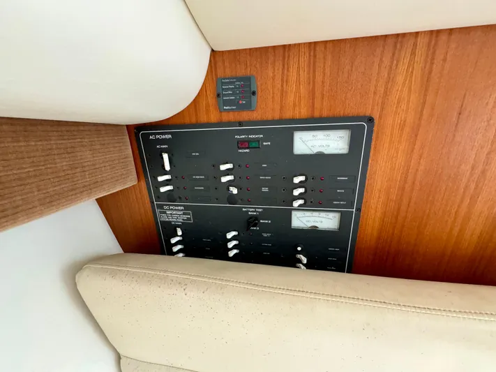 Castaways Yacht Photos Pics Control panel of a 2006 Tiara Yachts 29 Open, featuring AC and DC power switches.