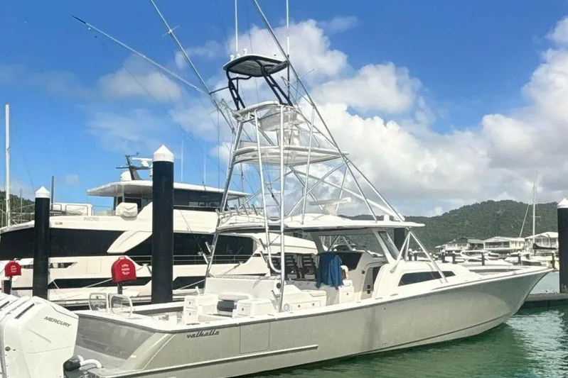  Yacht Photos Pics 2024 Valhalla Boatworks V-55 docked, featuring sleek design and advanced fishing tower.