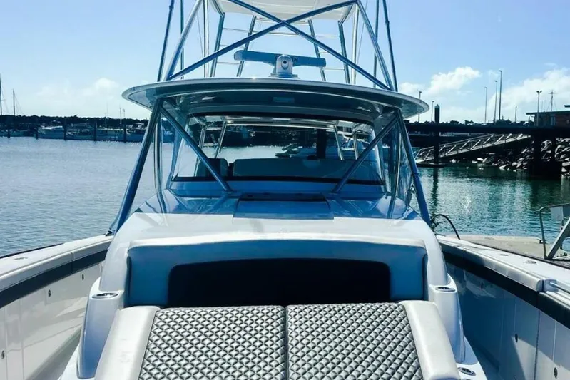  Yacht Photos Pics 2024 Valhalla Boatworks V-55 at marina, showcasing sleek design and spacious deck.