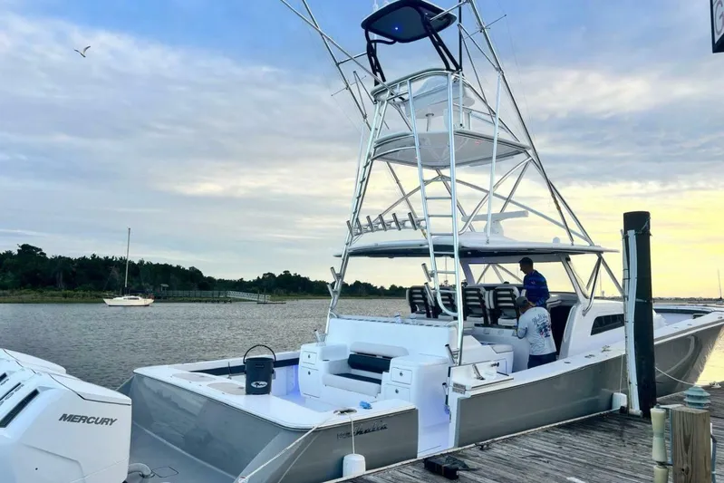  Yacht Photos Pics 2024 Valhalla Boatworks V-55 docked, featuring sleek design and modern amenities.