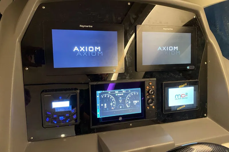  Yacht Photos Pics Control panel of a 2026 Hanover 375 with multiple digital displays and navigation systems.