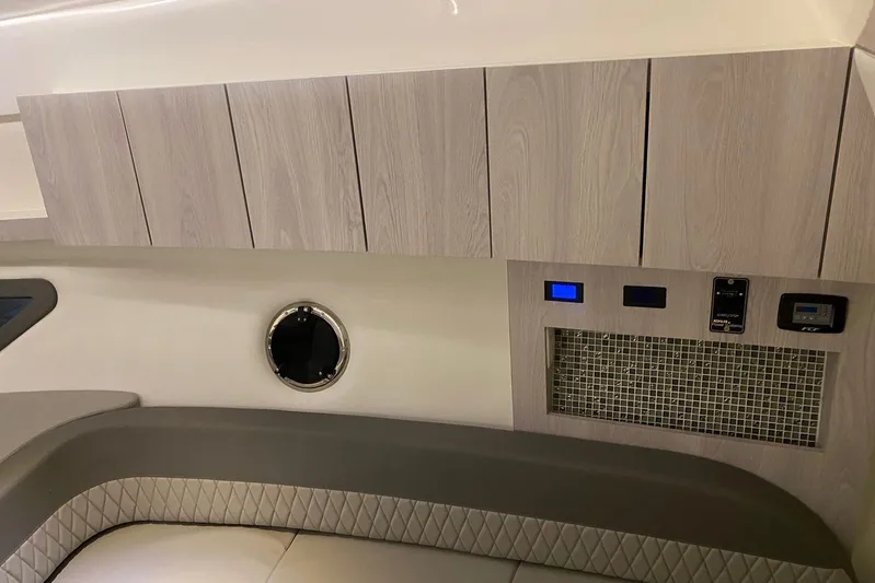  Yacht Photos Pics Interior of 2026 Hanover 375 boat with modern cabinetry and control panel.