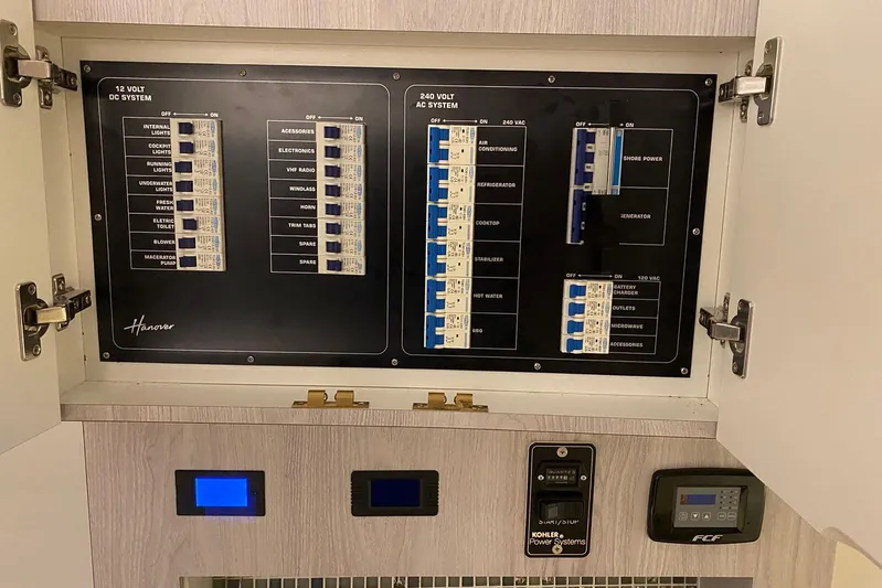  Yacht Photos Pics Electrical panel of a 2026 Hanover 375, featuring 12V DC and 240V AC systems.
