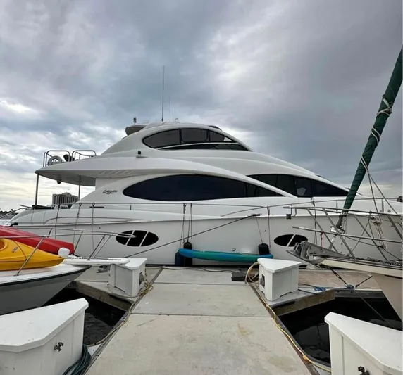  Yacht Photos Pics Luxury 2007 Lazzara 68 yacht docked under cloudy skies.