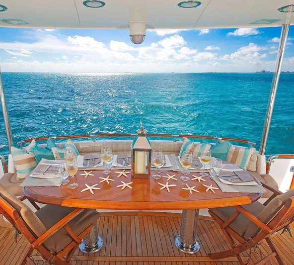  Yacht Photos Pics Luxurious dining setup on 2007 Lazzara 68 yacht with ocean view.