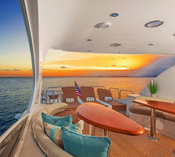  Yacht Photos Pics Luxurious 2007 Lazzara 68 yacht deck with sunset view over the ocean.