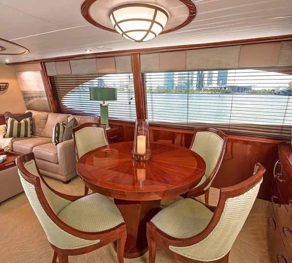  Yacht Photos Pics Luxurious interior of 2007 Lazzara 68 yacht with elegant dining area and waterfront view.