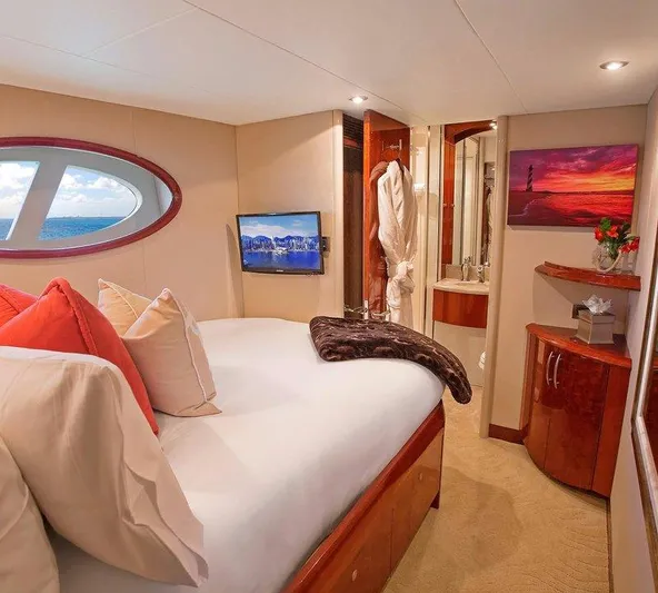  Yacht Photos Pics Luxurious bedroom interior of 2007 Lazzara 68 yacht with ocean view and elegant decor.