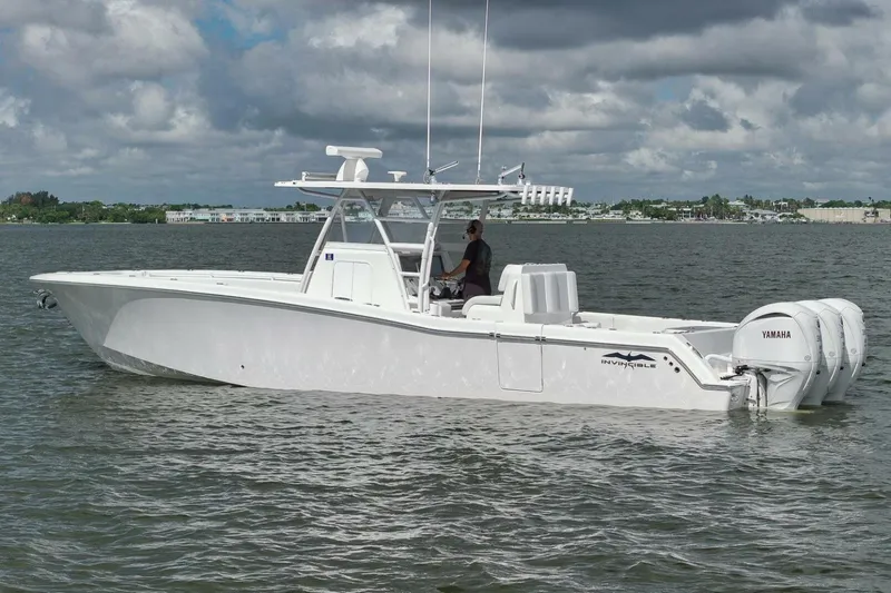  Yacht Photos Pics 2018 Invincible 36' Open Fisherman boat on calm water, featuring Yamaha engines.