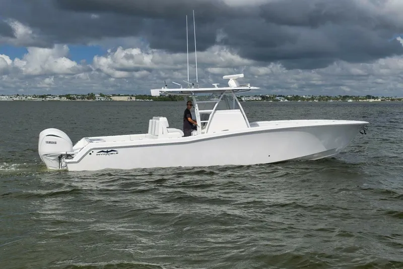  Yacht Photos Pics 2018 Invincible 36' Open Fisherman boat on water, featuring Yamaha engines.