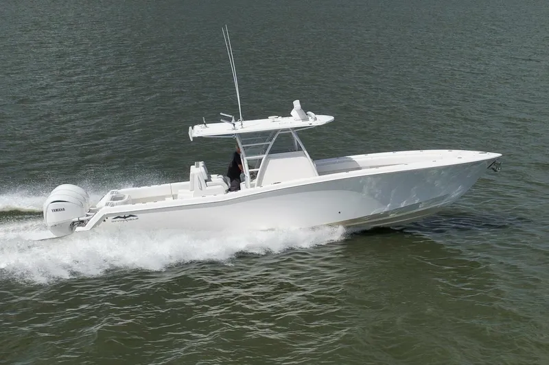  Yacht Photos Pics 2018 Invincible 36' Open Fisherman boat cruising on water.