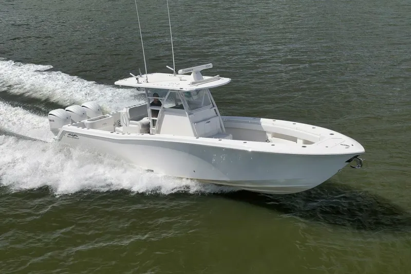  Yacht Photos Pics 2018 Invincible 36' Open Fisherman boat cruising on water.