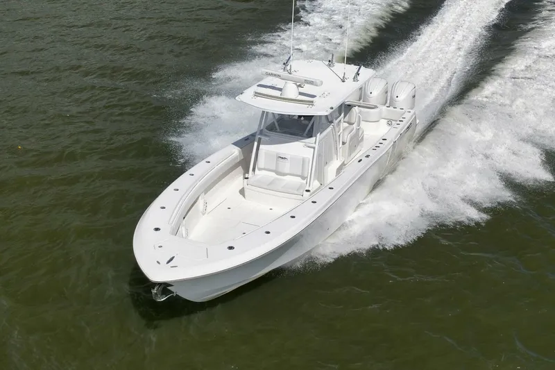  Yacht Photos Pics 2018 Invincible 36' Open Fisherman boat cruising on water.