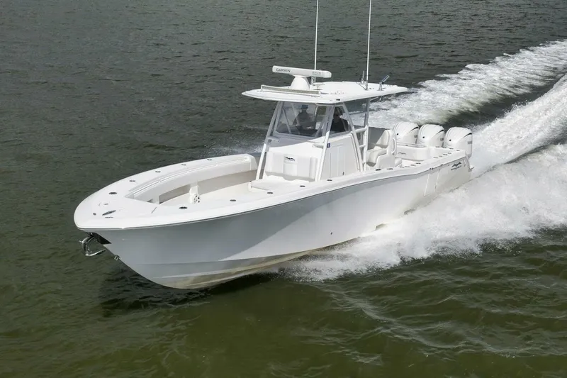  Yacht Photos Pics 2018 Invincible 36' Open Fisherman boat cruising on water.