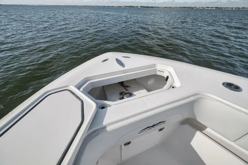  Yacht Photos Pics 2018 Invincible 36' Open Fisherman boat on calm water, featuring anchor storage.