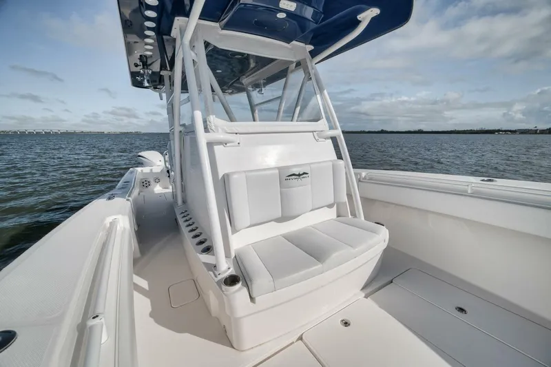  Yacht Photos Pics 2018 Invincible 36' Open Fisherman boat on water, showcasing seating and console.