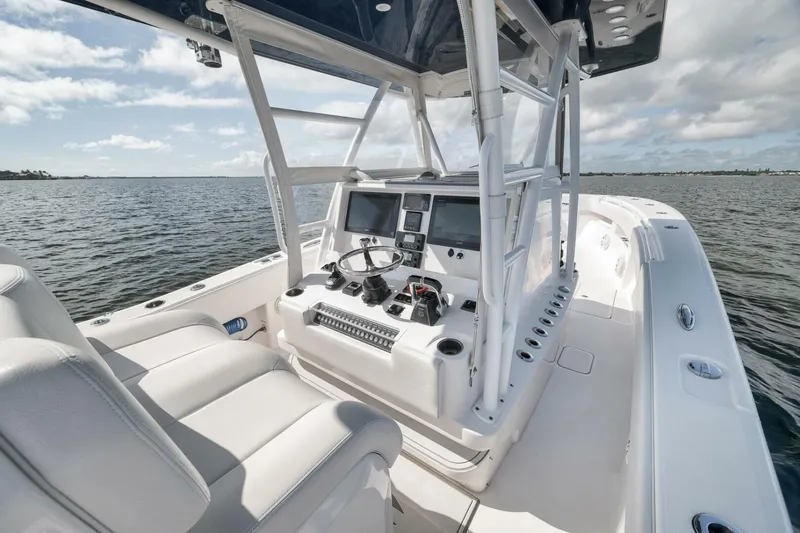  Yacht Photos Pics 2018 Invincible 36' Open Fisherman boat interior with dual screens and steering wheel.