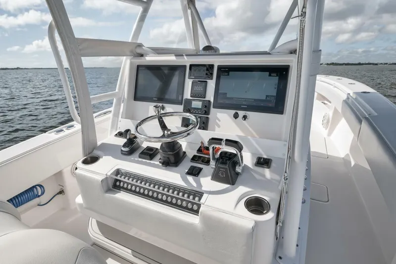  Yacht Photos Pics Control console of 2018 Invincible 36' Open Fisherman boat with navigation screens.