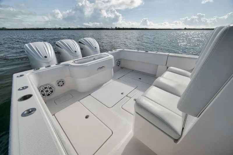  Yacht Photos Pics 2018 Invincible 36' Open Fisherman boat with triple engines on calm water.