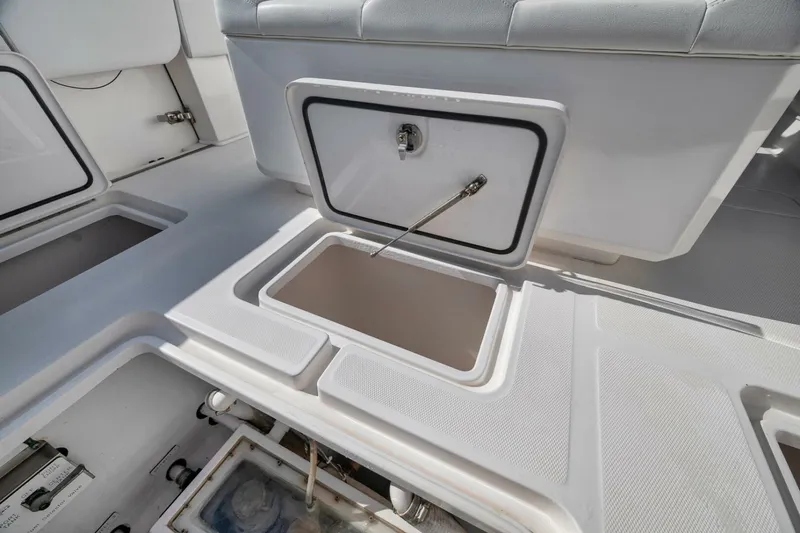  Yacht Photos Pics 2018 Invincible 36' Open Fisherman boat storage compartments and seating area.
