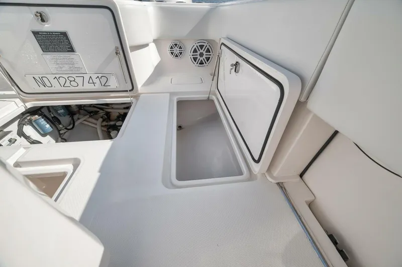  Yacht Photos Pics 2018 Invincible 36' Open Fisherman boat storage compartments and access hatches.