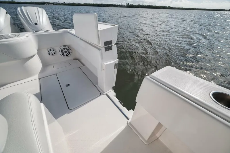  Yacht Photos Pics 2018 Invincible 36' Open Fisherman boat interior with ocean view, featuring sleek white design.