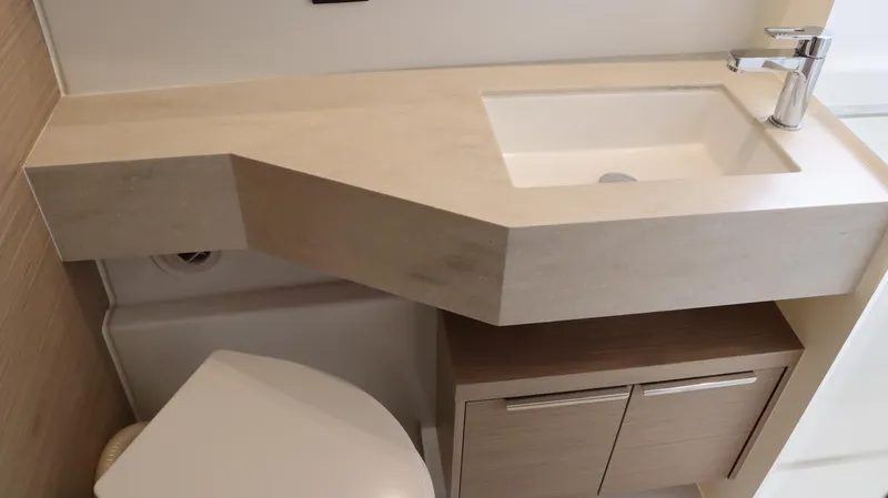 Happy Fluke Yacht Photos Pics Modern bathroom sink and cabinet in 2023 Lagoon 46 yacht.