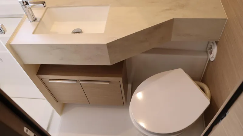 Happy Fluke Yacht Photos Pics Modern bathroom in 2023 Lagoon 46 yacht with sink and toilet.