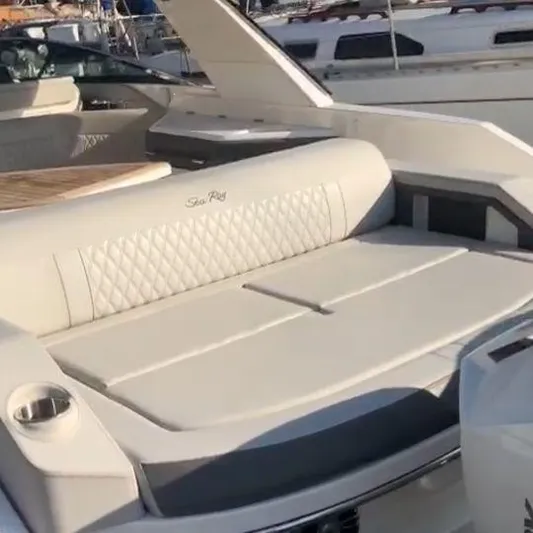  Yacht Photos Pics 2023 Sea Ray SLX310 boat with luxurious seating and sleek design.