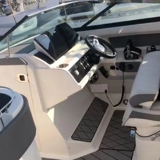  Yacht Photos Pics 2023 Sea Ray SLX310 boat cockpit with modern steering and controls.