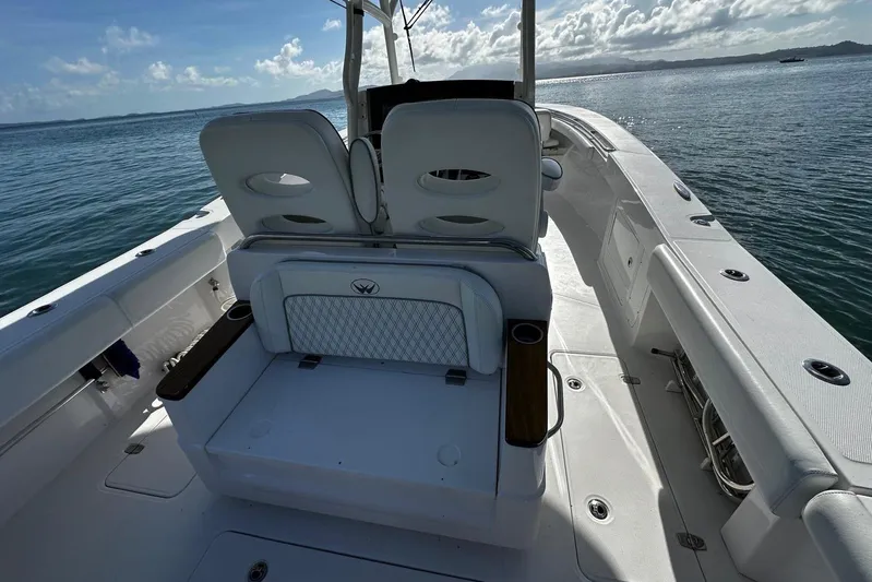  Yacht Photos Pics 2024 Southport 30 FE boat interior with seating, on calm ocean waters.