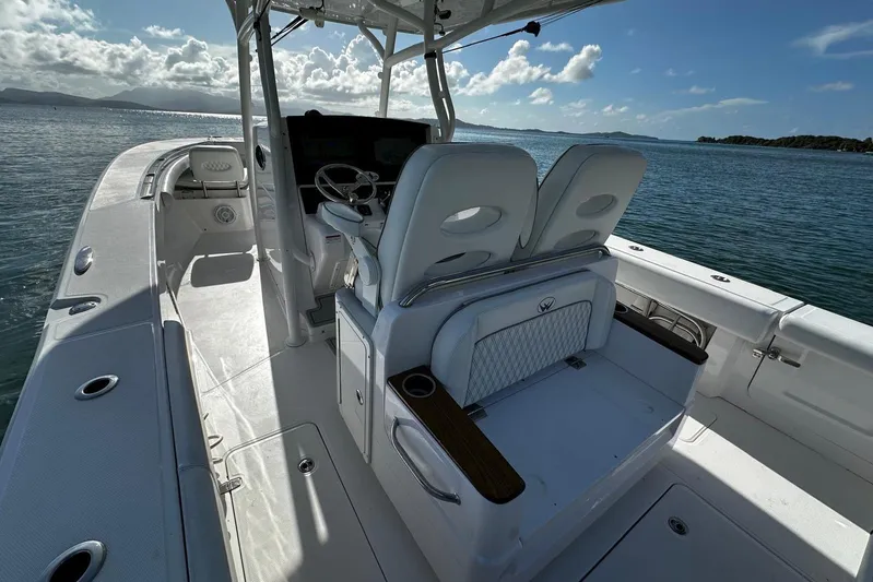  Yacht Photos Pics 2024 Southport 30 FE boat interior with helm and seating on open water.