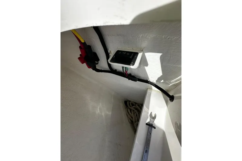  Yacht Photos Pics 2024 Southport 30 FE boat interior wiring and tools in storage compartment.