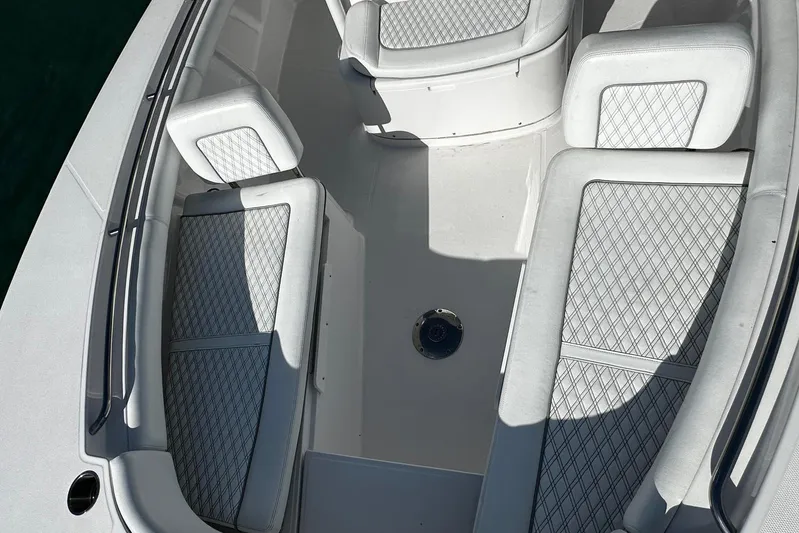  Yacht Photos Pics 2024 Southport 30 FE boat interior with diamond-stitched seating and spacious layout.