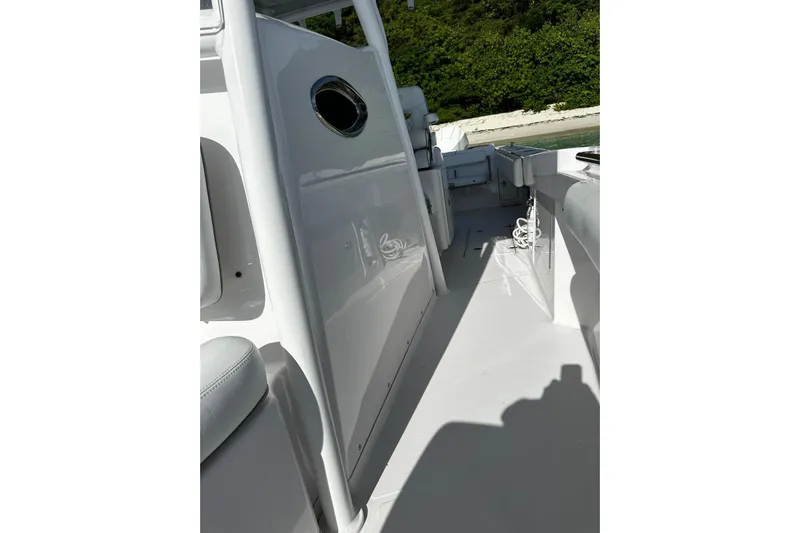  Yacht Photos Pics 2024 Southport 30 FE boat interior with sleek white design and seating area.