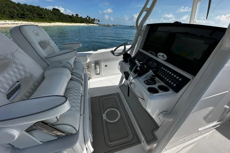  Yacht Photos Pics 2024 Southport 30 FE boat interior with modern helm and luxurious seating.