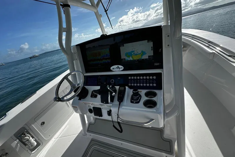  Yacht Photos Pics 2024 Southport 30 FE boat cockpit with advanced navigation system and steering wheel.