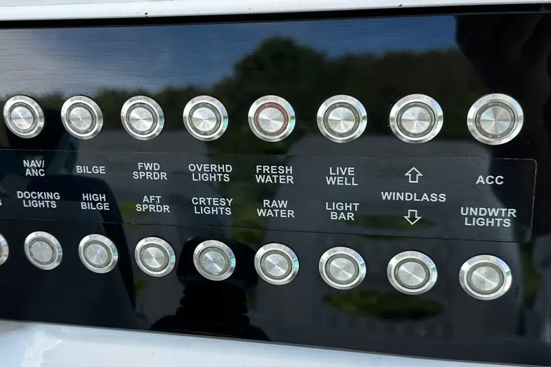  Yacht Photos Pics Control panel of 2024 Southport 30 FE boat with labeled buttons and switches.