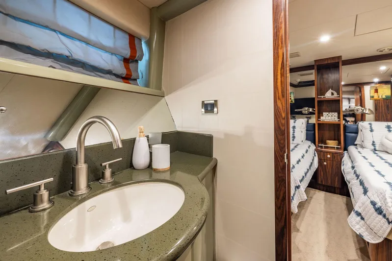 Party's Over Yacht Photos Pics Luxurious 2006 Northstar Enclosed Flybridge interior with modern bathroom and cozy bedroom.