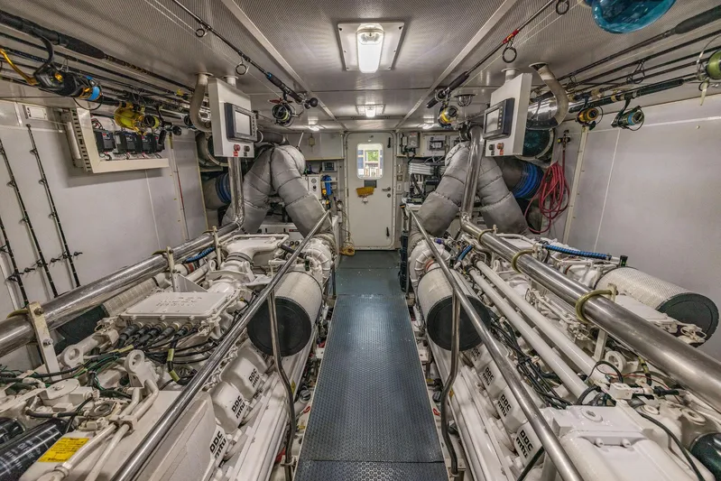 Party's Over Yacht Photos Pics Engine room of 2006 Northstar Enclosed Flybridge yacht, featuring dual engines and advanced equipment.